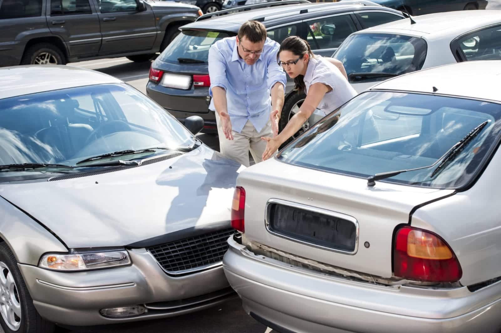 Drivers Arguing After A Car Accident Stock Photo