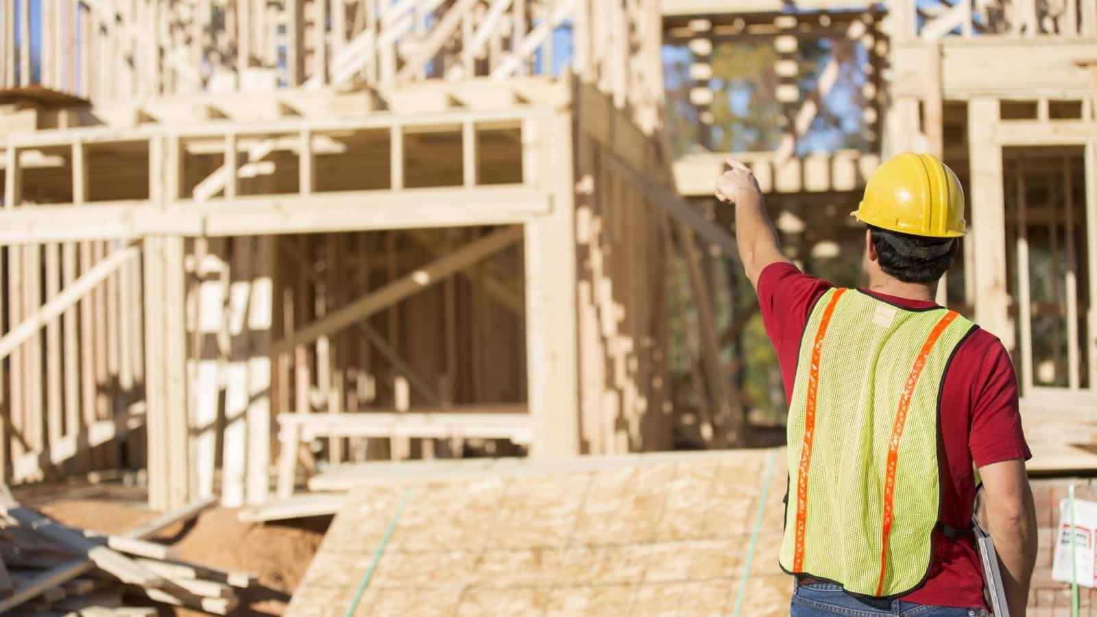 Construction Worker Building A Home Stock Photo